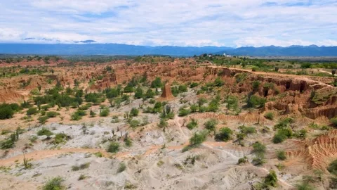 Aerial view of vibrant red cliffs in Tatacoa Desert Stock Footage 330591935