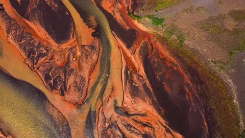 Aerial view of vibrant river delta with red sediment, Iceland. Stock Footage 341430646