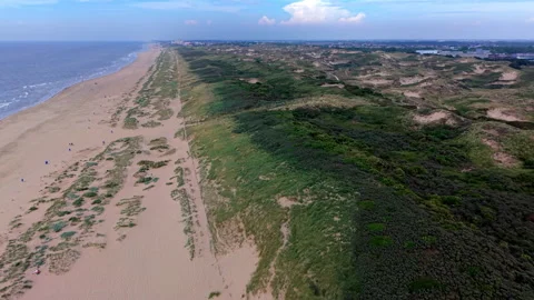 Aerial view video clip of Katwijk aan Zee coastline green sand dunes broad Stock Footage 341698569