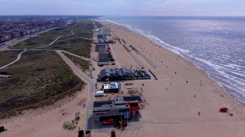 Aerial view video clip of Katwijk aan Zee sandy beach, lifeguard rescue station Stockbeeldmateriaal 341974535