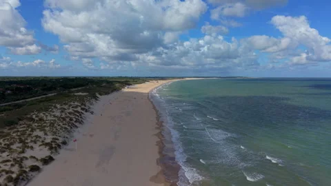 Aerial view video clip of sandy beach coastline, sea waves, coastal dunes Stock Footage 342397025