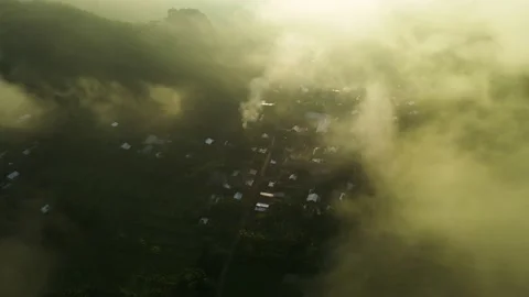 Aerial view, a view of rice fields and hills shrouded in mist in the morning Stock Footage 188397243