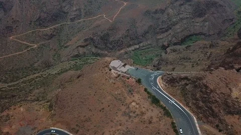 Aerial view on viewing platform in the middle of mountain cliffs in overcast Stock Footage 94118214