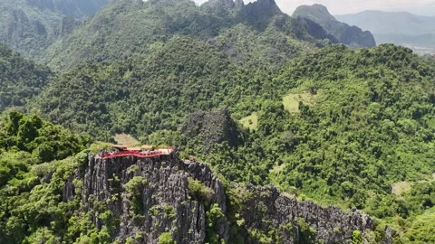 Aerial View of Viewpoint on Limestone Peak Above Jungle Valley, Pha Ngern Laos Stock-Footage 347417822