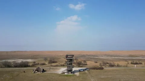 Aerial view of a viewpoint tower on the lakeshore, landscape view, Austria, 4k Stock Footage 235693953