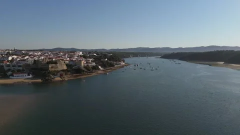 Aerial view of Vila Nova de Milfontes, its fort and boats on the Mira River Stock Footage 346373399