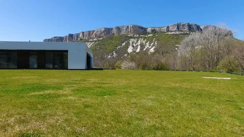 Aerial view. Villa with pool in the mountains. View of the forest and mountains Stock Footage 129559564