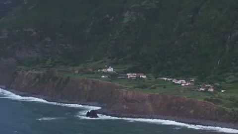 Aerial view of village by ocean with cliffs, Portugal. Stock Footage 279725501