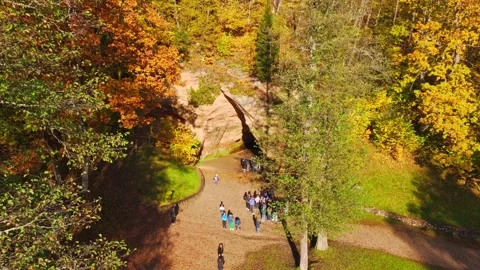Aerial View of Visitors Exploring Gutman Cave in Gauja National Park Latvia Stock Footage 339028845