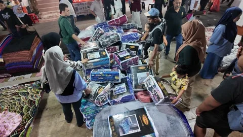Aerial view of visitors shopping bedding at pesta penang night market Stock Footage 332736714