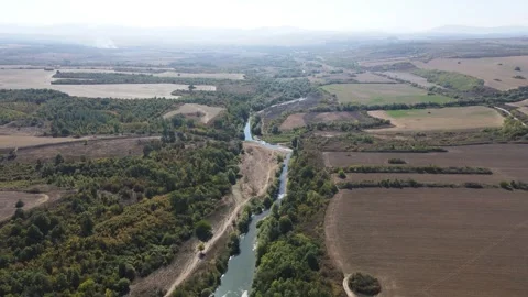 Aerial view of Vit river, passing near village of Aglen, Bulgaria Stock Footage 253173212