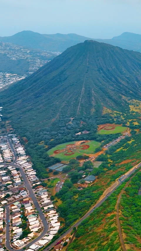 Aerial View of Volcanic Cone With Baseball Fields Below Vertical video. Stock Footage 335388926