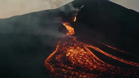 Aerial view of volcanic eruption with glowing lava flow Video stock 331990373