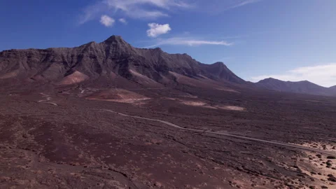 Aerial view of volcanic mountain range near Playa de Cofete in Fuerteventura Stock Footage 310358334