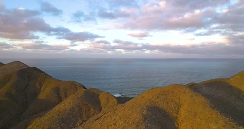 Aerial View of Volcanic Mountain Range in Magdalena Bay Mexico at Sunrise Stock Footage 334638638