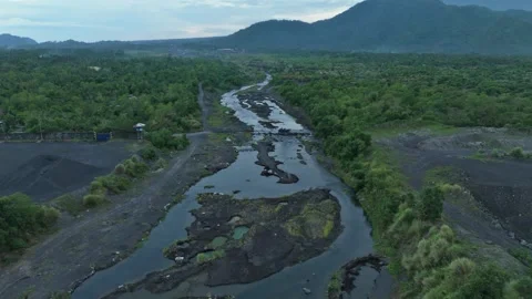 Aerial view of volcanic riverbed and aggregate extraction site near Mayon. Stock Footage 337063238