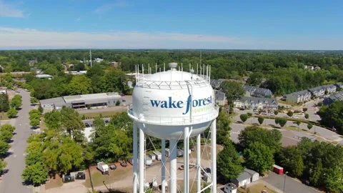 Aerial View of Wake Forest NC Water Tower and Downtown Skyline Stock Footage 346563882