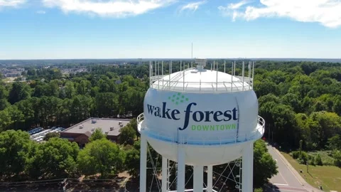 Aerial View of Wake Forest NC Water Tower and Town Streets Stock Footage 346564083