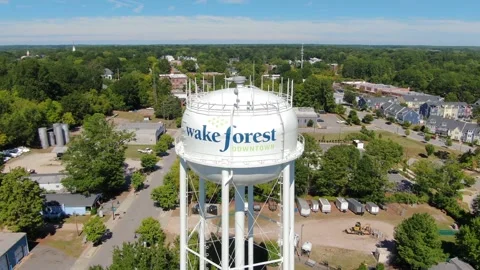 Aerial View of Wake Forest NC Water Tower and Surrounding Town Stock Footage 346564176
