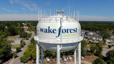 Aerial View of Wake Forest NC Water Tower and Town Skyline Stock Footage 346564355