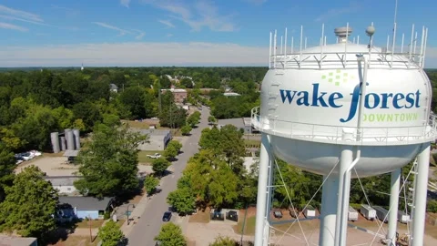 Aerial View of Wake Forest Water Tower and Downtown Streets in NC Stock Footage 346564248
