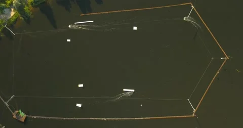 Aerial view of the wake park from the cable car and athletes dissecting the Stock Footage 157623511