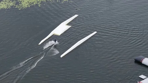 Aerial view of wakeboarder at cable park in Vilnius, Lithuania. Stock Footage 341426346