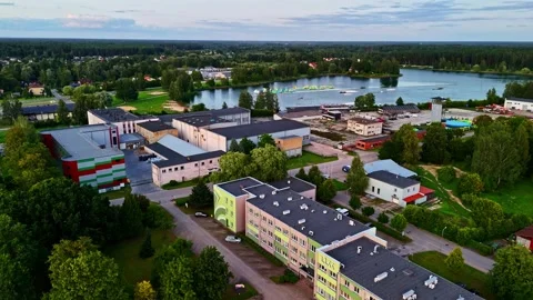 Aerial view of wakeboarding cable park on Ozolnieki Lake in summer evening in Stock-Footage 323256036