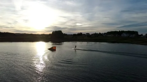 Aerial view of wakeboarding at sunset Stock Footage 67504485