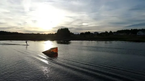 Aerial view of wakeboarding at sunset Stock Footage 67504504