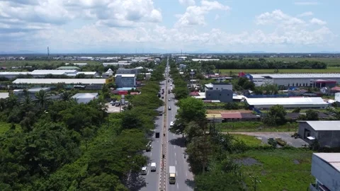 Aerial view of the warehouse area and main road of Banjarmasin Stock Footage 322081037