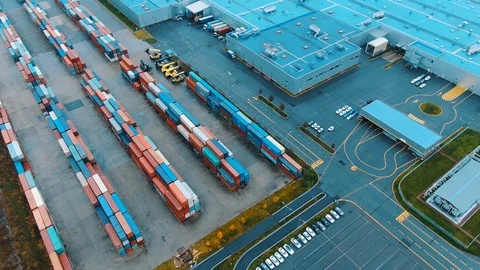 Aerial view of the warehouse with cargo containers, loading equipment, trucks Stock Footage 122584930