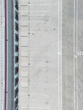 Aerial view of a warehouse loading dock and empty parking area.  Clean line.. Stock Photos