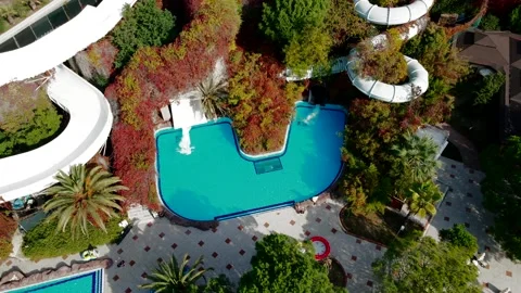 Aerial View of Water Park with Pools and Winding Water Slides Stock Footage 296514165