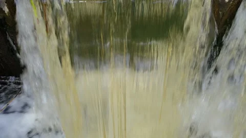 Aerial view of water rushing through the gates at a dam. Stock Footage 193049082
