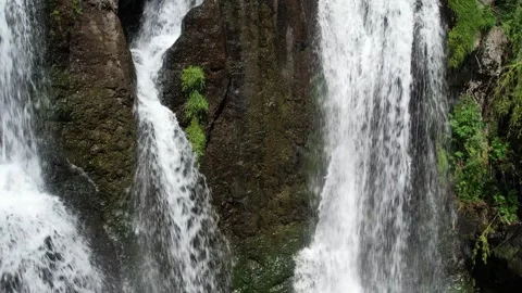 Aerial view of water streams running down mossy cliffs, Shaki waterfall Stock Footage 342843143