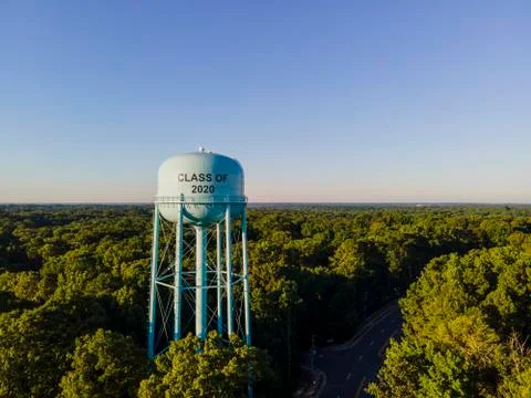 Aerial View of Water Tower Class of 2020 text with Trees and Blue Sky Stock Photos
