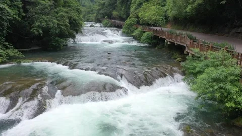 Aerial View of Waterfall and Forest in Xiaoqikong, Guizhou Vídeos de archivo 345155361
