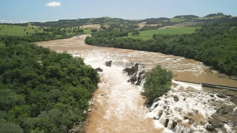 Aerial view of a waterfall and rushing river. Salto Saudades. 4K. Stock Footage 233219662