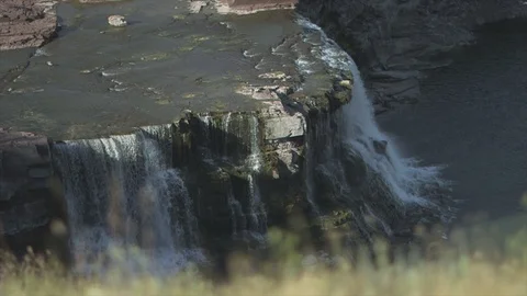 Aerial View of a Waterfall in the Background on a Grey Day HD Video Stock Footage 90053207