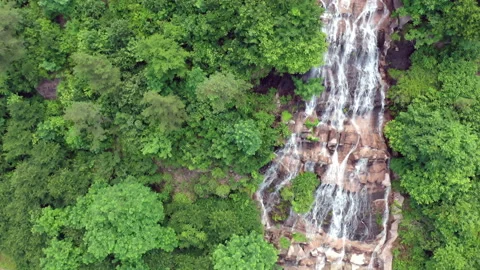 Aerial view of waterfall cascading down side of mountain  Stock Footage 137509822