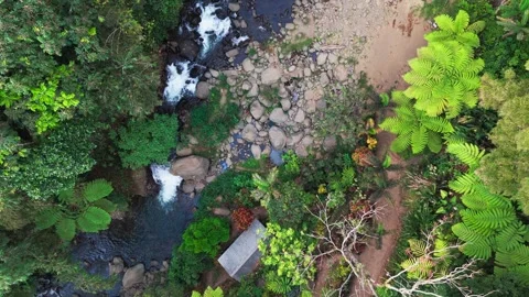 Aerial view of a waterfall cascading through basalt columns Stock Footage 340273940