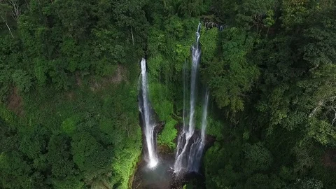 Aerial view of Waterfall in green rainforest Stock Footage