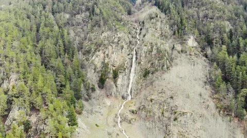 Aerial view of the waterfall. Mountain river flows down from high gray mountain Stock-Footage 157628528