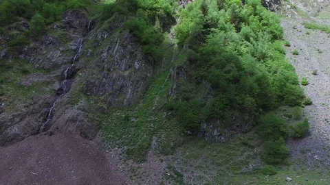 Aerial view of a waterfall in the mountains Stock-Footage 77056964