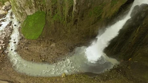 Aerial View of a Waterfall Plunging Down the Rocky Kara-Syrt Ridge in Dagestan, Stock Footage 325637507