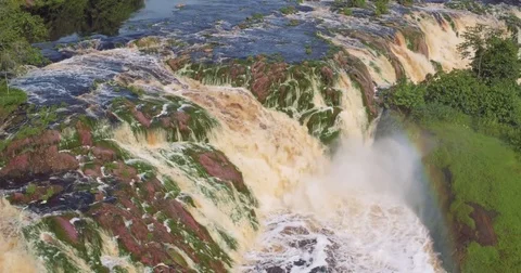 Aerial view waterfall rainbow equatorial river lost in the forest Stock Footage 82354939
