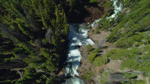 Aerial view of a waterfall in the rugged Beartooth Mountains, Montana Stock Footage 267128567