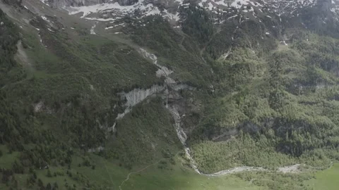 Aerial view of a waterfall in the Swiss Alps Stock Footage