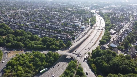 Aerial view of the waterworks roundabout looking down the A406 dual carriageway Stock Footage